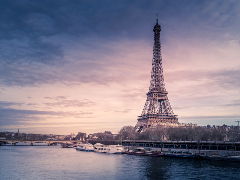 Paris Eiffel Tower and city rooftops at dusk